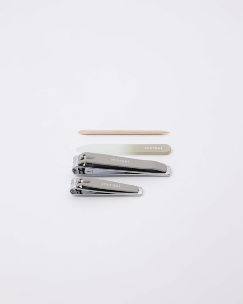 Four hair clips of different sizes and colors are stacked on a white background.