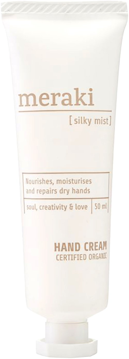 En hvid tube med lysebrun tekst, mærket Meraki silky mist håndcreme, lover at fugte og reparere tørre hænder.
