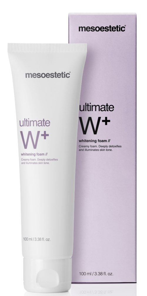 En vit tub med Mesoestetic whitening foam bredvid en lila förpackning. Tuben och boxen visar produktnamnet och märket.