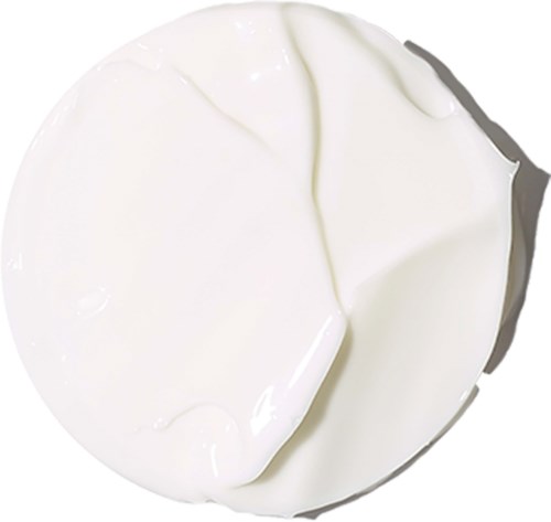 En rund vit sak med slät yta, möjligtvis en klick grädde eller yoghurt.