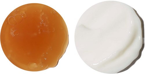 Orange sås och vit majonnäs i runda klick på vit bakgrund.
