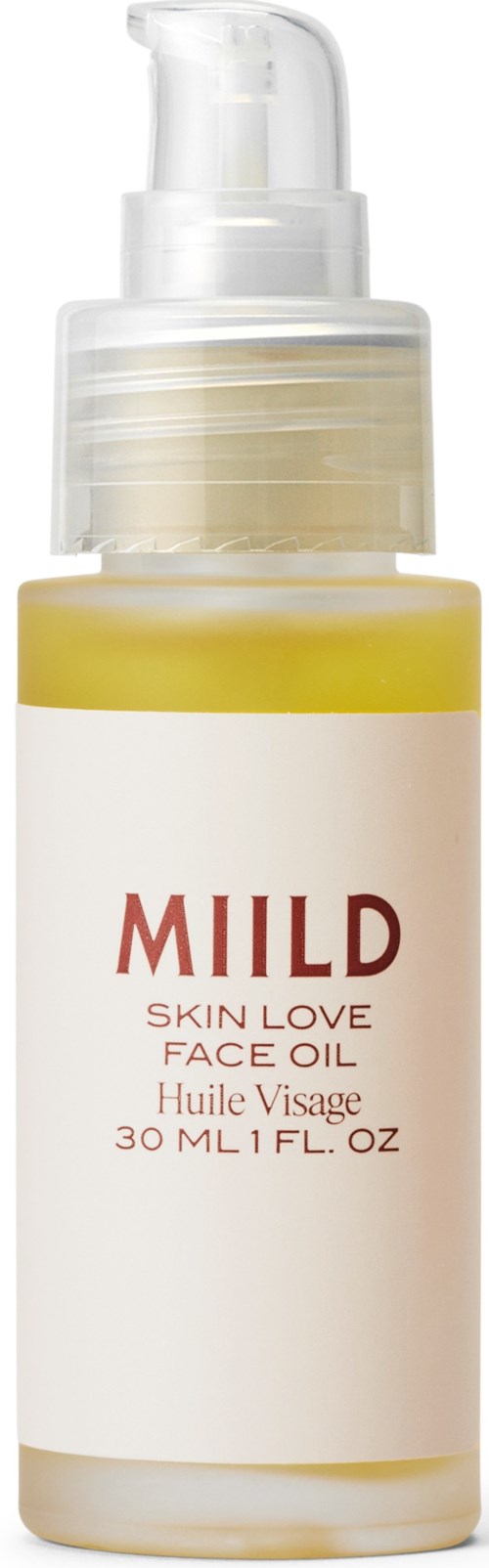 Pieni keltainen ja valkoinen pullo pumppa, jossa lukee 'MILD SKIN LOVE FACE OIL'.