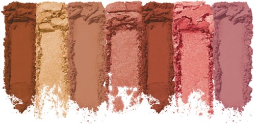Rows of crushed, powdery blush in various shades from light beige to pink. Would be used for makeup or art.