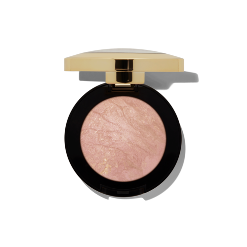 A round makeup product with a black border and a beige lid, containing light pink powder or eyeshadow.