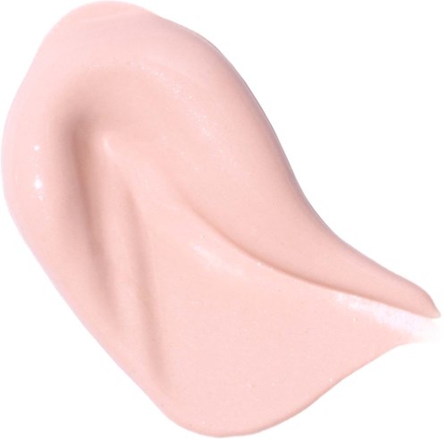 Krem spredt med glatt, skinnende, beige overflate og en liten bøyet form.