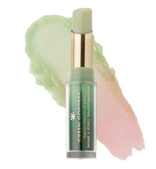A small green tube with a white and gold cap. The tube has text about a balm for lips and skin.