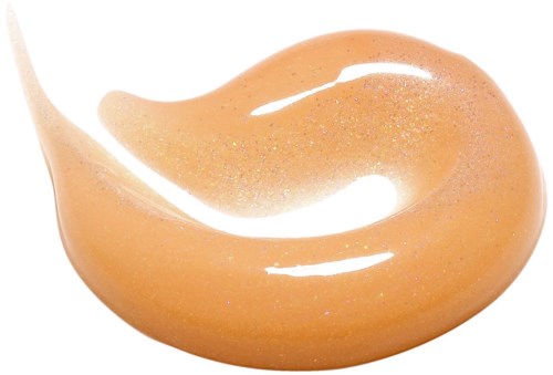 En droppe av persikofärgad vätska med glitter och glänsande yta.
