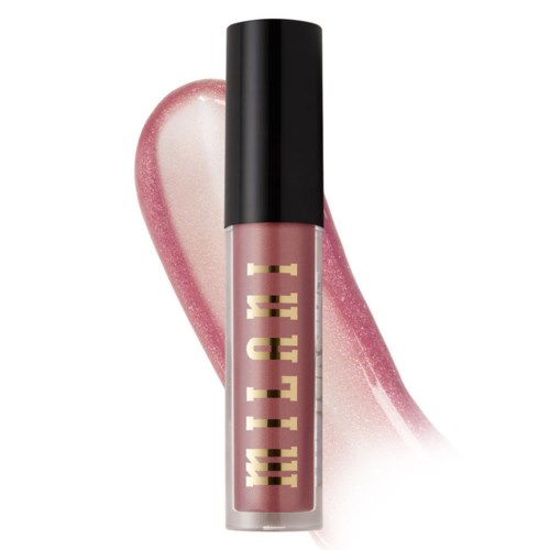 Läppglanstuben är rosa med svart lock, och har ett glänsande, glitterhjärta bakom.