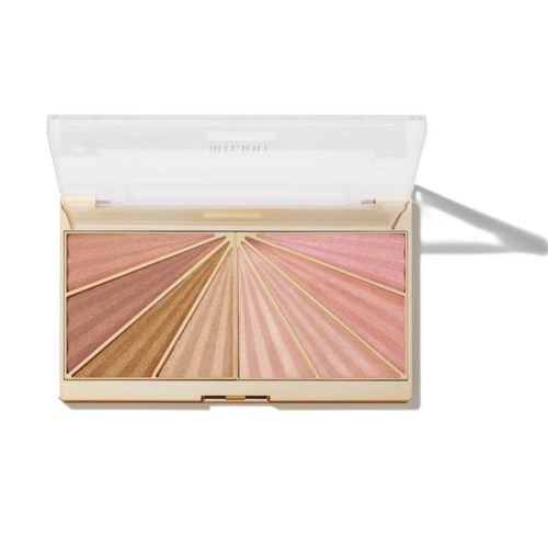 Eine Makeup-Palette mit verschiedenen Pink- und Brauntönen, durch Goldlinien getrennt, in einem Beigen Gehäuse mit klarem Deckel.