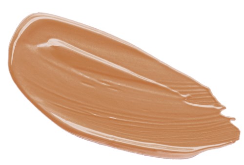 En beige krämig spridning med jämna, släta drag på en svart bakgrund.