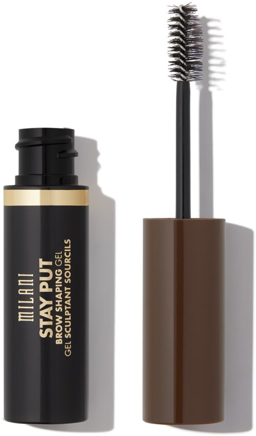En svart och guldtub med gel och en brun huva, och en borste. Produkten heter 'The Fix Stay All Day Gel'.