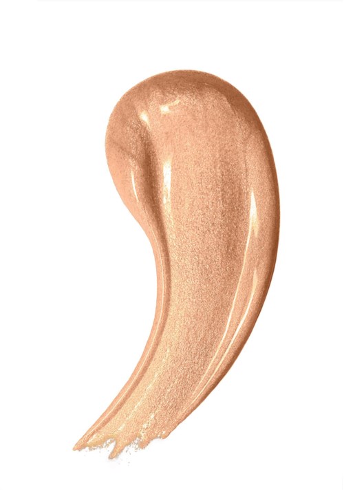 En beigefärgad makeup- eller foundationssmula med en glansig, krämig textur.