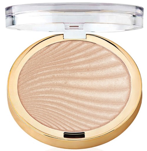 Ett runt makeupprodukt med ett metalliskt guldhölje, innehållande ljusbeige pressad puder med ett vågigt mönster.