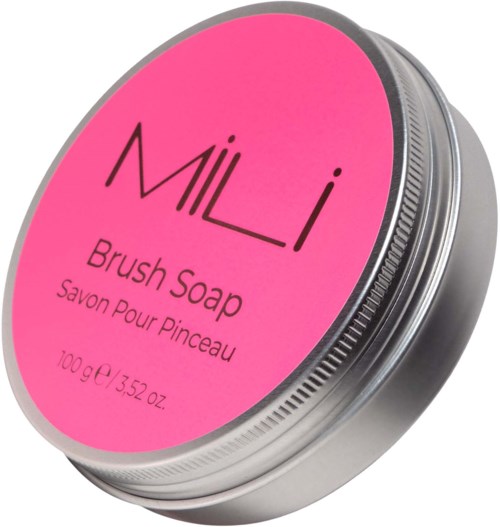 En rund metalbeholder med et pink label, der står 'MILI Brush Soap' og vægt.