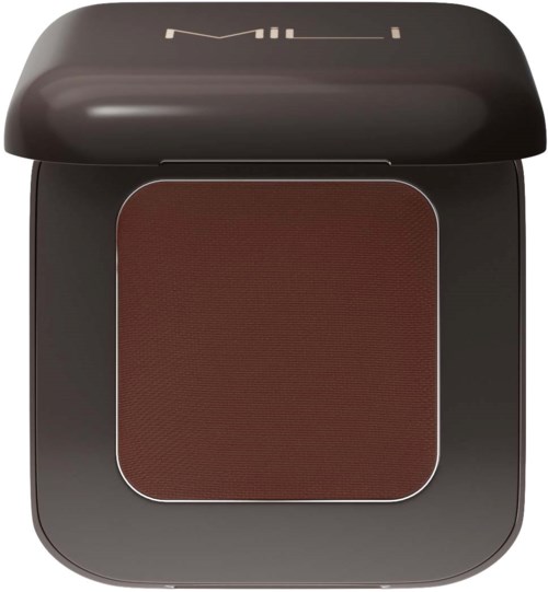 A makeup compact with reddish-brown pressed powder and a black lid, partially open.