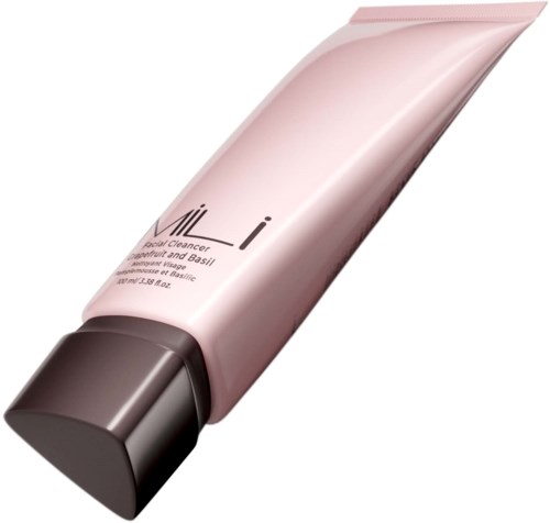 A pink tube with a black cap, likely a skincare or beauty product.