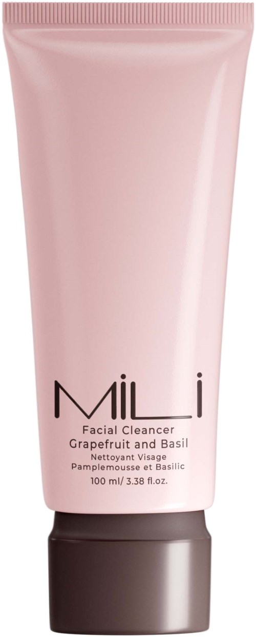 A pink facial cleanser tube labeled 'MILI' with grapefruit and basil scent, 100 ml capacity.