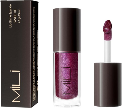 En läppglansrör med rosa glittrig produkt och ett matchande läppstiftprov. Produkten heter 'Lush Shine Sparkle' av MILANI.
