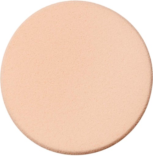 Een groot, rond beige voorwerp met een gladde, matte oppervlakte en een lichte gebogen rand.