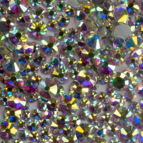 A large collection of colorful, shiny crystals or rhinestones with reflective surfaces and various sizes.