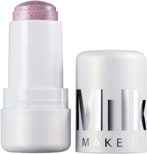 A white cylindrical container with a pink, glittery stick of lipstick inside. The lipstick cap is off, showing the lipstick.