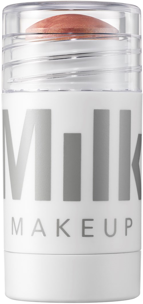 Ein weißer Behälter mit transparentem Deckel, mit den Worten "Milk Makeup" darauf. Der Behälter hat eine runde Oberseite.