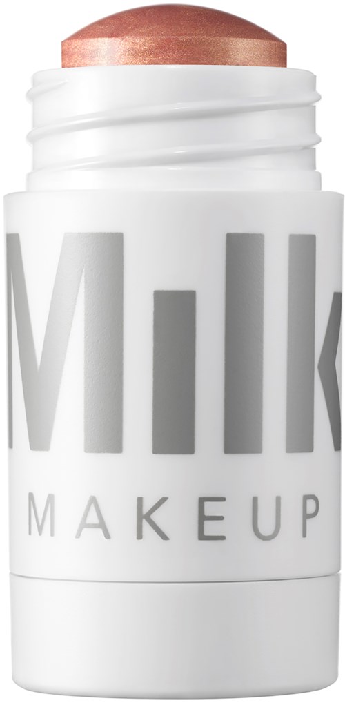 Ein weißer Makeup-Roller mit teilweise sichtbarem Text 'MILK' und einem braunen Makeup-Stick.
