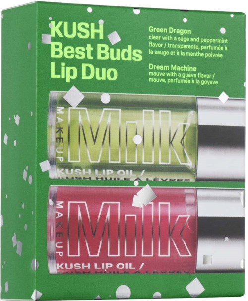 En grønn eske med to leppeolje-flasker, en grønn og en rosa, med produktnavn og beskrivelser.