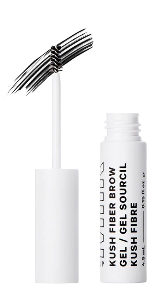 Valkoinen putki, jossa lukee "KUSH FIBRE BRUSH GEL GELL SOURCIL" ja päässä maskaraharja. Yksinkertainen muotoilu, ei koristeita.