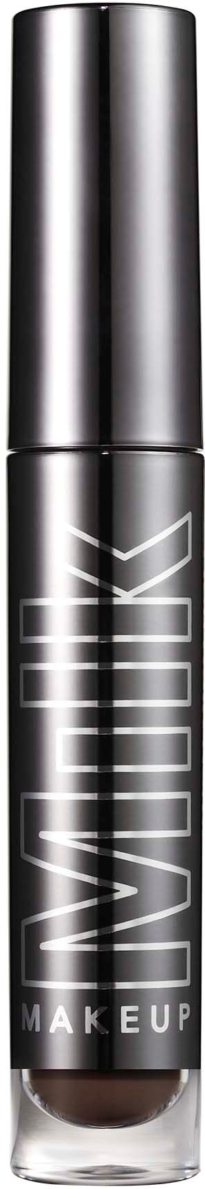 Ett svart cylindriskt makeup-produktskydd med en tydlig botten visar mörkbrunt smink inuti. Etiketten säger 'NYX Makeup'.