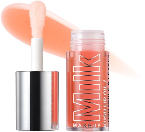 Lip gloss container with peach-colored gloss and applicator. Bold text on the bottle says "MEDIUM". Colorful background streak.