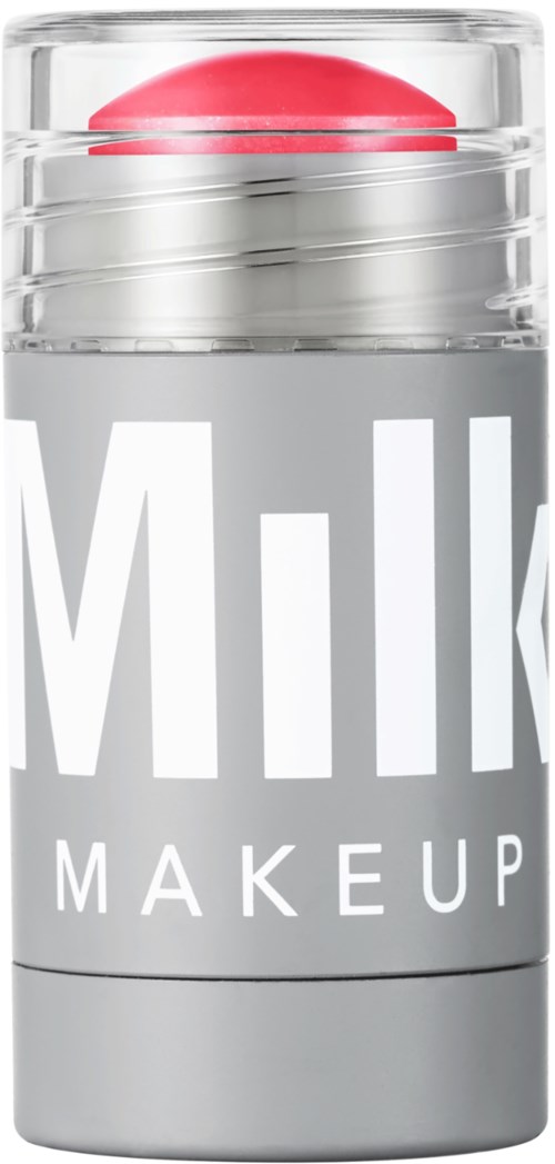 Läppbalsam i en genomskinlig behållare med röd balm inuti och grå etikett som säger 'milk makeup'.