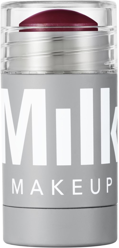 En gjennomsiktig makeup-beholder med en rød leppestift inni, merket 'Milk Makeup' med store hvite bokstaver.