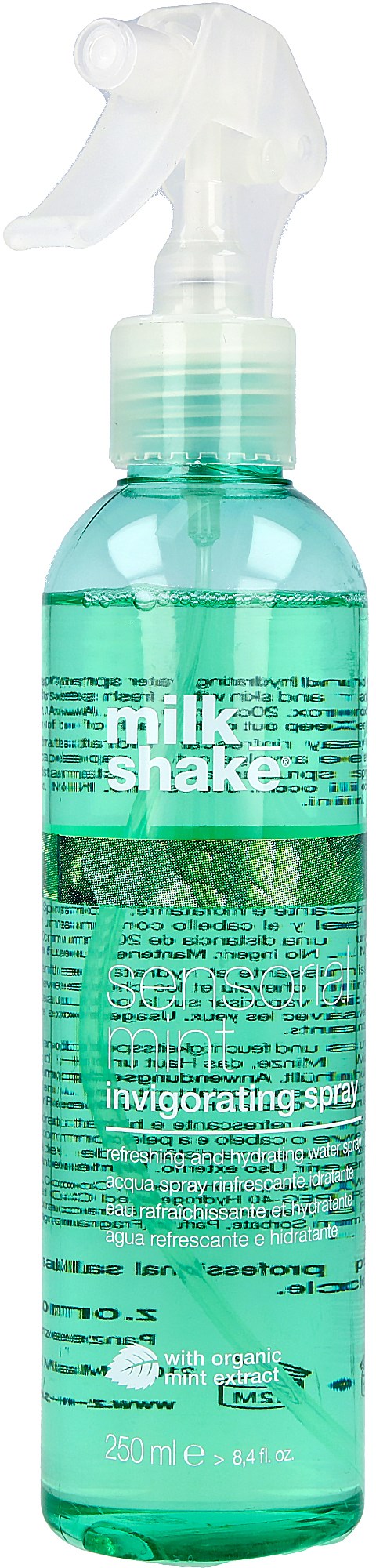 Grön sprayflaska märkt 'milk shake' med klart vätska inuti.