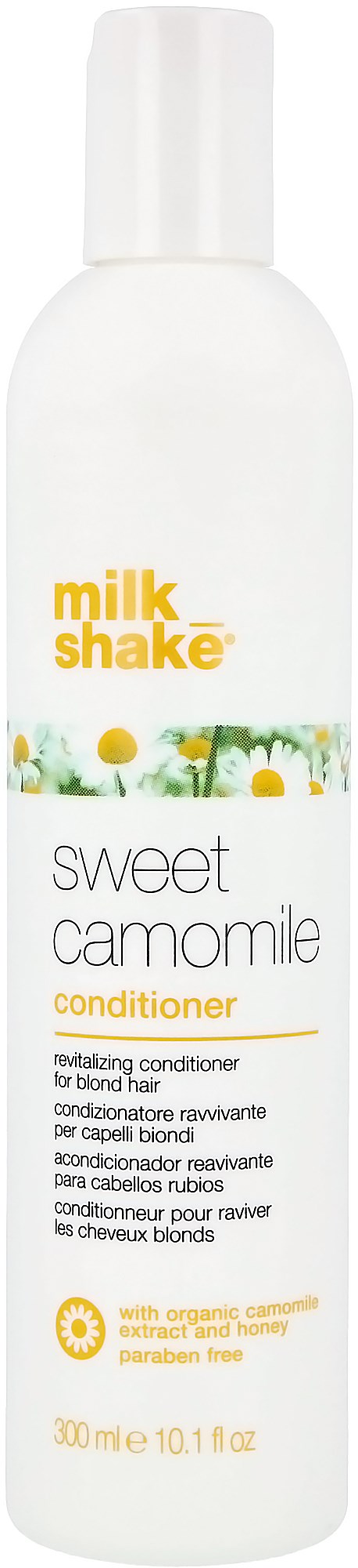 En hvid flaske mærket "Milk Shake" med et gult og hvidt blomsterdesign, kaldet "Sweet Camomile Conditioner".