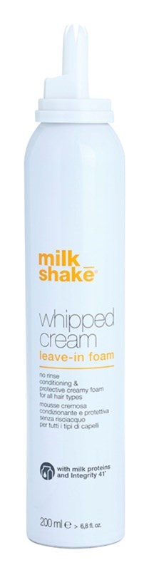 A white bottle with a nozzle, labeled milkshake whipped cream leave-in foam, used for hair.