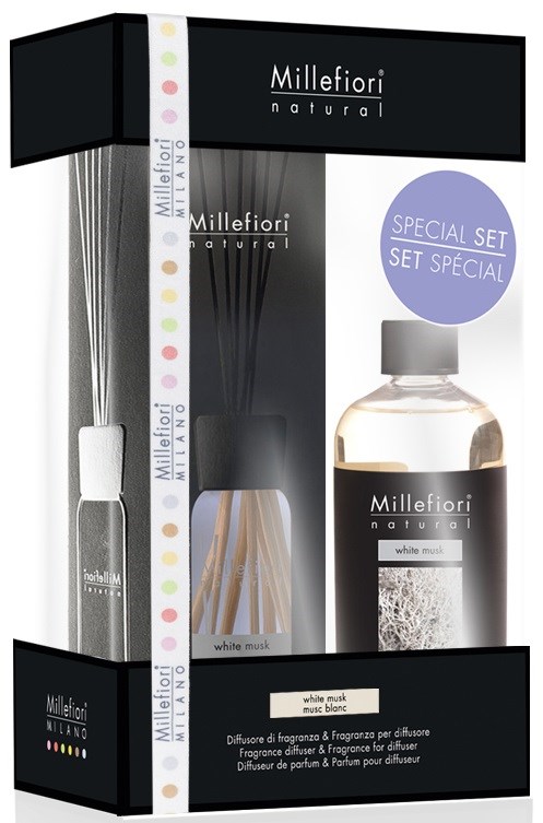 Ett set med Millefiori naturliga hemduftprodukter, inklusive en flaska och diffuserstavar, med svart, vitt och färgglad förpackning.