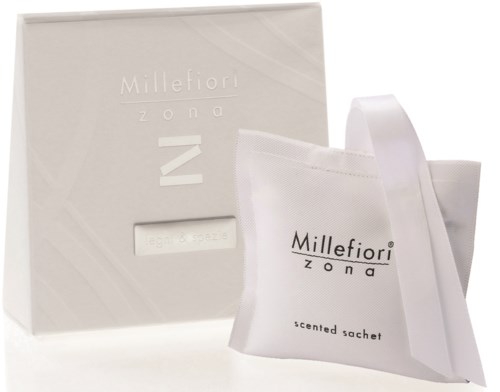 En vit låda och påse med texten "Millefiori zona" och "scented sachet" på dem.