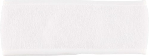 A white rectangular object with a textured surface, looks like a foam or sponge, with a flat top.