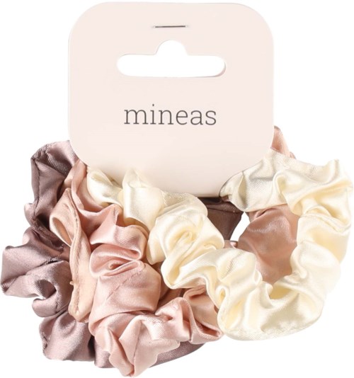 Set of pastel-colored satin scrunchies on a white card. The card has the word "mineas" printed on it.