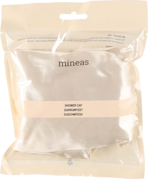 A silver shower cap in clear plastic packaging with minimal text and a hanging hole at the top.