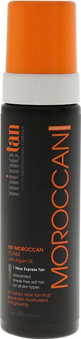 En svart flaska med orange lock, märkt 'Moroccan untilan' med text om hudvård, orange detaljer.