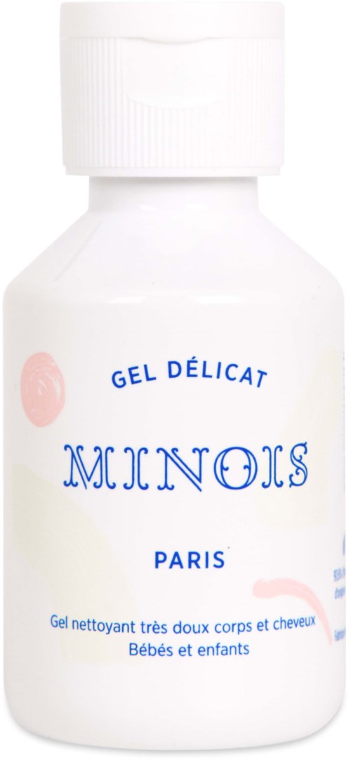 En vit flaska med vit lock och blå och rosa text, märkt 'MINOIS' och 'GEL DÉLICAT'.