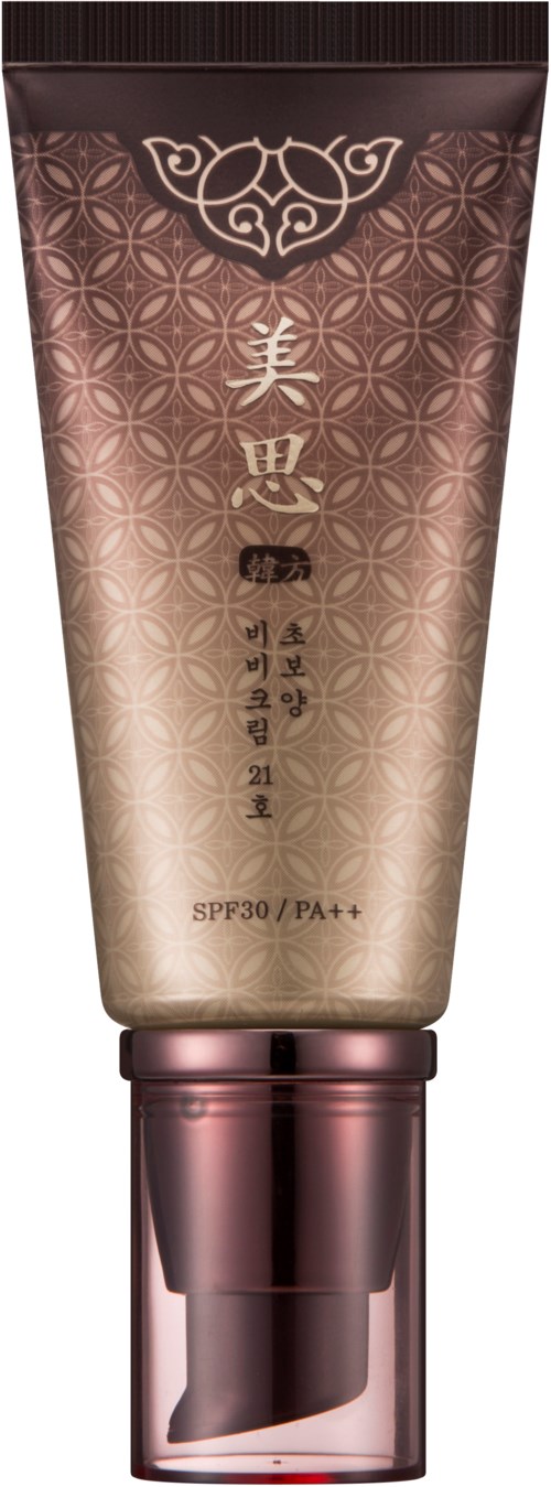 En beige och rosa tub med asiatiska tecken, dekorativa mönster och en SPF30/PA++-etikett.