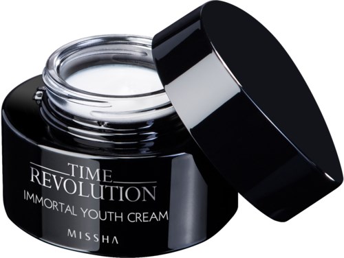 En svart burk med öppet lock som visar vit kräm, märkt 'Time Revolution Immortal Youth Cream'.