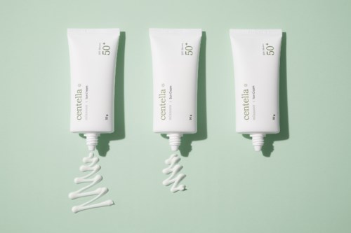 Three white tubes with cream swirl designs, labeled 'centella', on a light green background.
