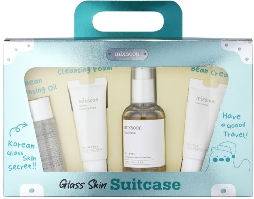 The set contains four skincare products in a suitcase-shaped package, including cleansing foam, toning oil, bean cream, and spray.