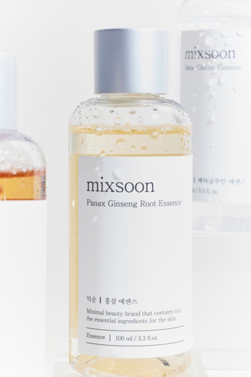 A clear bottle labeled 'mixsoon' with a white cap, containing a light yellow liquid, likely skincare essence.