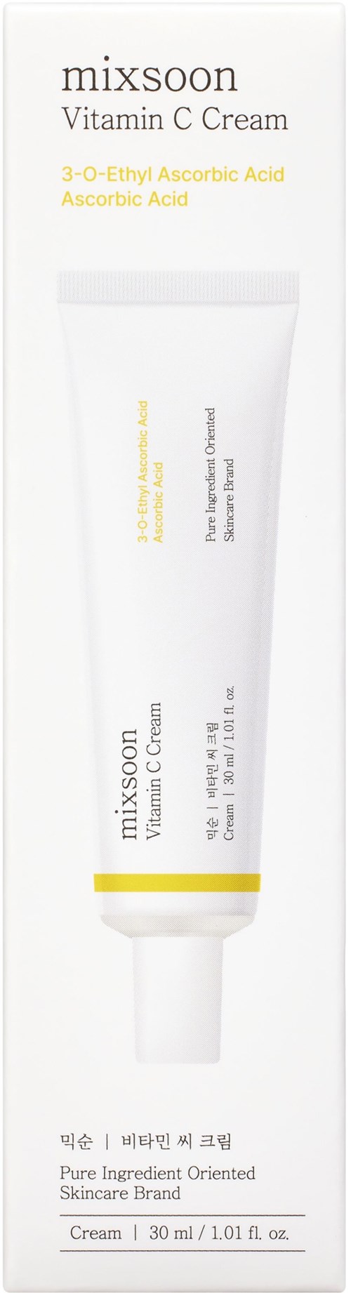 Weiße Tube mit Vitamin C-Creme mit gelbem und schwarzem Text, auf einer weißen Box. Es ist ein Hautpflegeprodukt.