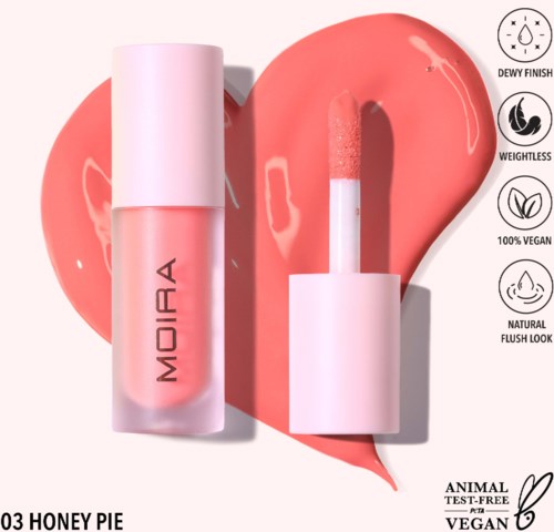 Lip gloss with pink color, wand applicator, and a pink heart-shaped background. Features include dew finish, vegan, natural look.
